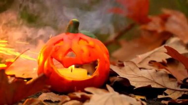 Halloween.Burning Pumpkin Jack lantern on sparks and smoke background. 4k footage