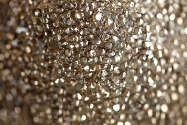  Bronz tonlarda arkaplan kopyalama alanı. Duvar kağıdı metalik granüler fon. Parlak kumlu doku..