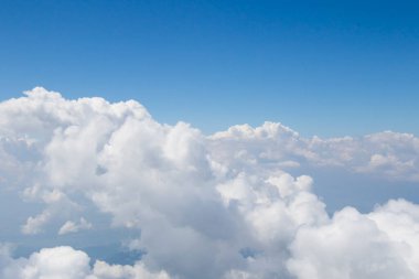 Clouds and blue sky view and landscape, from the helicopter, blue and white colors