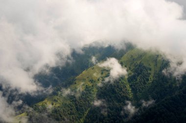 Tusheti mountain landscape and view, high angle, Georgian nature, clouds and forest