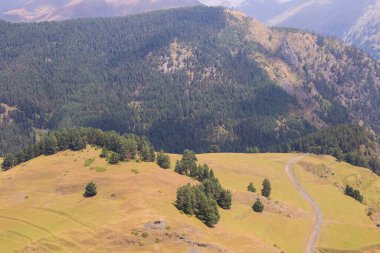 Tusheti mountain landscape and view, high angle, Georgian nature, clouds and forest