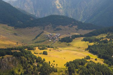 Tusheti mountain landscape and view, high angle, Georgian nature, clouds and forest