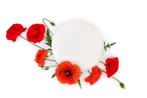 Flowers red poppies ( corn poppy, corn rose, field poppy ) with white circle paper card note with space for text on a white background. Top view, flat lay