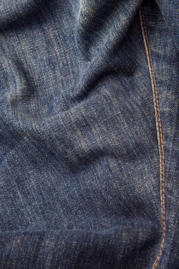 Kot pantolon, mavi kot kumaş dokusu, klasik kot pantolon dokusu, yakın çekim. Reklam veya klasik arkaplan için kopyalama alanı olan kot dokusunun mavi rengi.