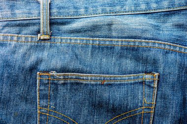 Kot pantolon, mavi kot kumaş dokusu, klasik kot pantolon dokusu, yakın çekim. Reklam veya klasik arkaplan için kopyalama alanı olan kot dokusunun mavi rengi.