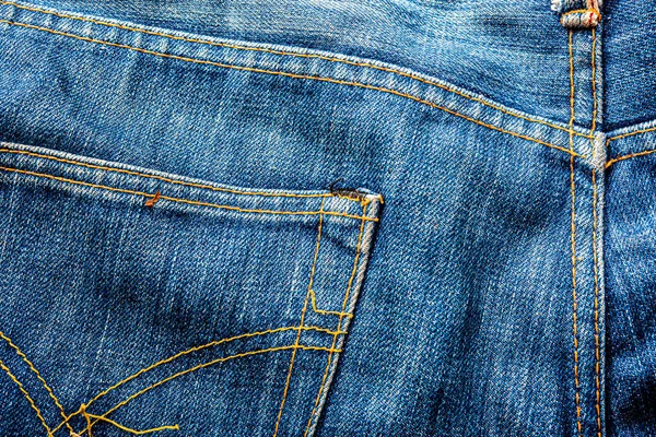 Kot pantolon, mavi kot kumaş dokusu, klasik kot pantolon dokusu, yakın çekim. Reklam veya klasik arkaplan için kopyalama alanı olan kot dokusunun mavi rengi.