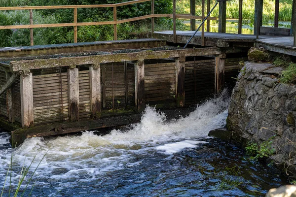 Water intake at an old water mill at Ronne river, Stockamollan, Scania county, Sweden