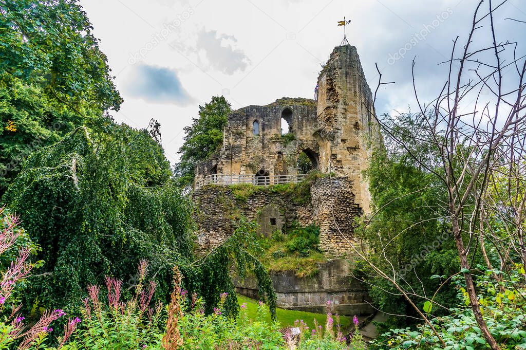 A view from the castle gardens towards the castle ruins in the town of Knaresborough in Yorkshire, UK in summertime