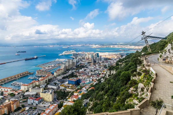 A view from the middle section of the cable car above the town of Gibraltar on a spring day