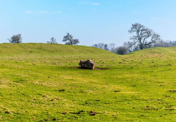 A view across the centre towards the entrance of the Iron Age Hill fort remains at Burrough Hill in Leicestershire, UK in early spring