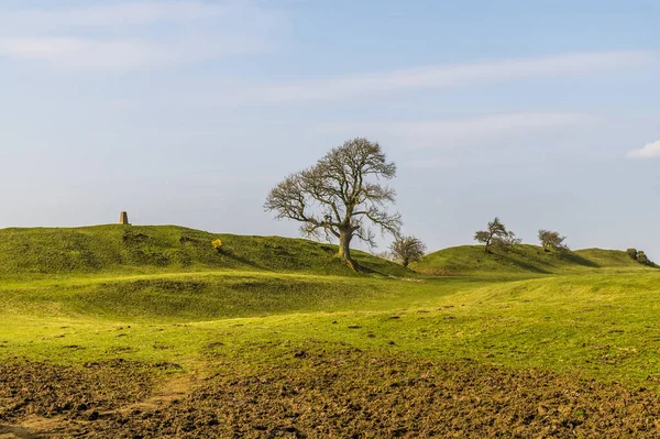 A view of the eastern ramparts of the Iron Age Hill fort remains at Burrough Hill in Leicestershire, UK in early spring