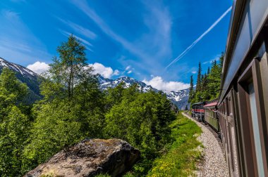 A view up a train on the White Pass and Yukon railway near Skagway, Alaska in summertime