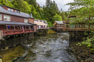 A view from a walkway towards the stilted buildings along the Creek in Ketchikan, Alaska in summertime