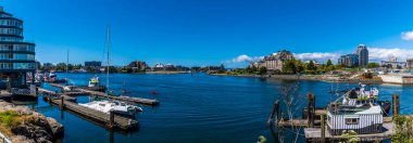 A panorama view across moorings in the harbour in Victoria British Colombia, Canada in summertime