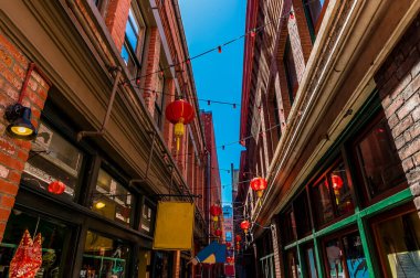 A view down a narrow shopping alleyway in Chinatown in Victoria British Colombia, Canada in summertime
