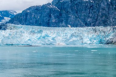 A view of calving from the Marjerie Glacier in Glacier Bay towards, Alaska in summertime