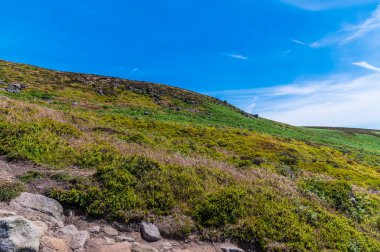 A view looking up towards the top of Bamford Edge in summertime