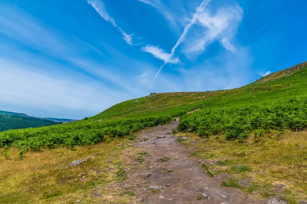 A view of the path up to Bamford Edge above the Hope Valley in summertime