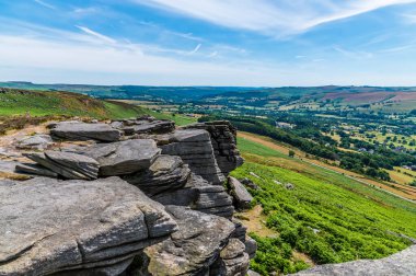 A view along the rocky escarpment on the top of the Bamford Edge, UK in summertime