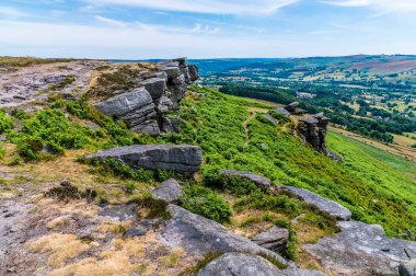 A view down the slopes from the top of Bamford Edge, UK in summertime