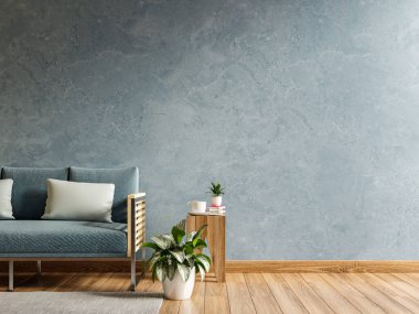 Boş oturma odası, mavi kanepesi ve boş mavi beton duvarlı bir masa.