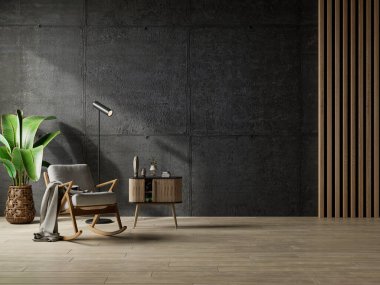 Oturma odasının içi tavan arası tarzında. Boş beton duvarda gri koltuğu var.