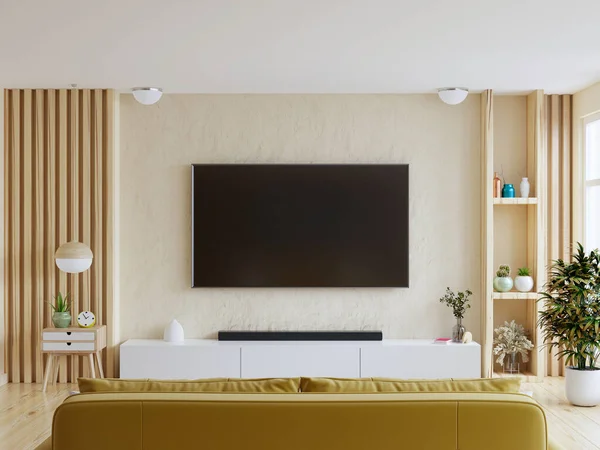 Mockup a TV wall mounted with yellow sofa in living room with a white wall.3d rendering
