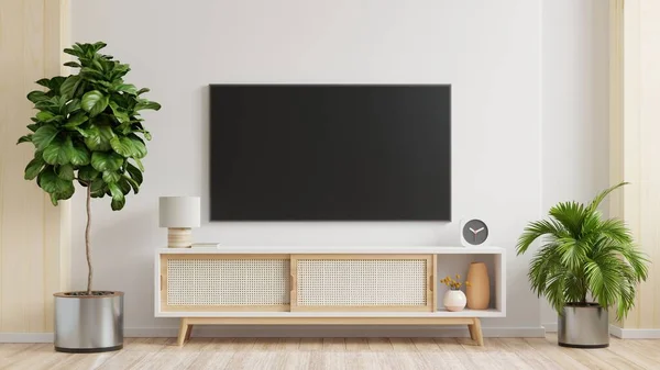 White wall mounted tv on cabinet in living room,minimal design.3d rendering