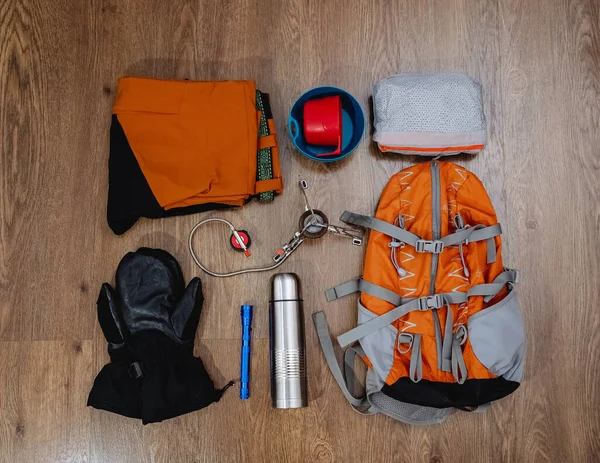 Hiking Equipment Backpack Pants Thermos Mittens Lantern Windbreaker Lie Floor — Stockfoto
