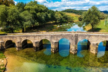 Aerial view of the old stone bridge on the Dobra River, Croatia
