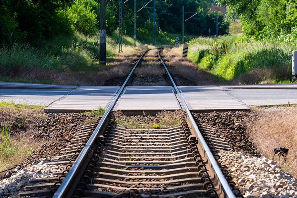 Railroad and car crossing on a sunny summer day. 