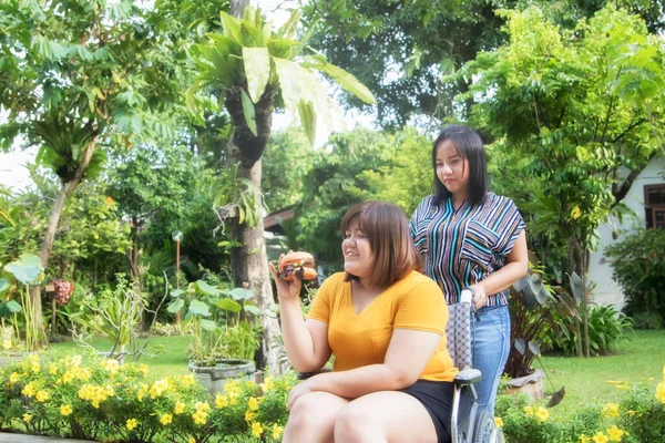 Girl Friend Takes Care Fat Woman Satisfied Disabled Friend Eat — Stock Photo, Image