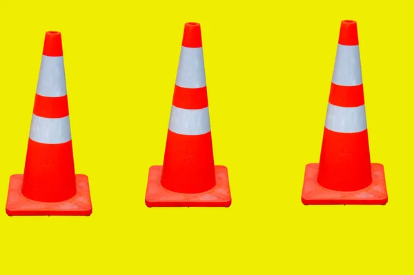 Three Red Traffic Cones Yellow Background — Stock Photo, Image