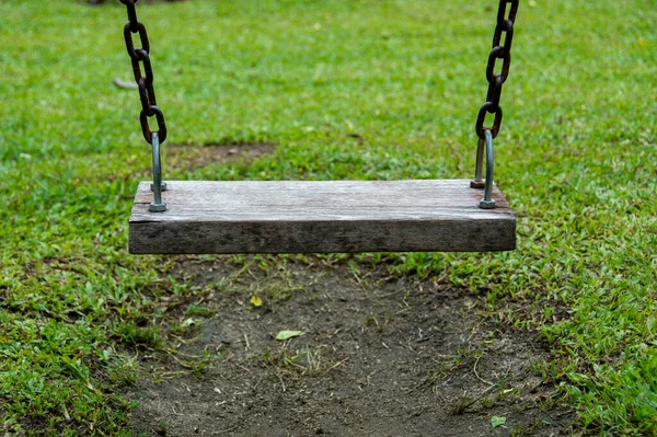 Old Wooden Swing Outdoor Park Has Trace Stepping Grass Soil — Zdjęcie stockowe