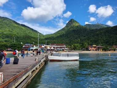 Tourists arriving at the Jetty of Abraao on Ilha Grande, Rio de Janeiro, Brazil
