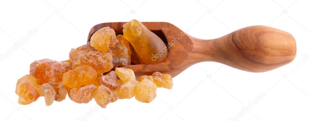 Frankincense resin in olive scoop, isolated on white background. Pile of natural frankincense Olibanum. Incense