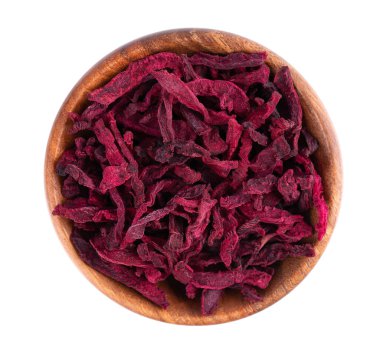 Dry beetroot in wooden bowl, isolated on the white background. Chopped dried beet. Top view