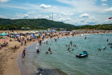 People are swimming in the public beach in Ava, Istanbul. 2022,June 30; Sile, istanbul, Turkiye