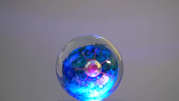 Wobling Colored Glass Paper Weight Orb — Stock Video