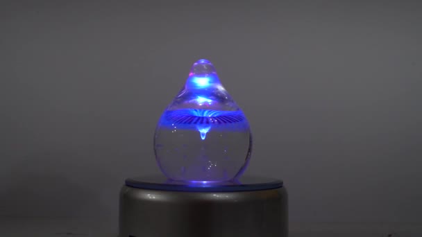 Rotating Colored Glass Paper Weight Orb — Stock Video