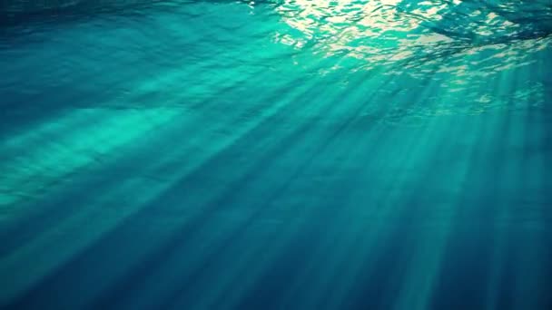 Underwater view with sunbeams shining and creating god rays in the deep sea — Stock Video