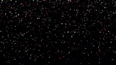 Renkli konfeti geçiş aşamasında. Siyah üzerine parlak bir parıltı.