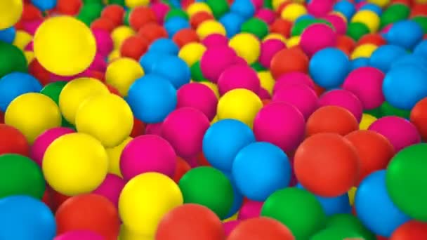 Multicolored spheres closeup in pool for children fun abstract background — Stock Video