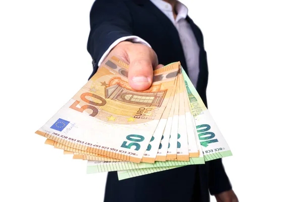 Hombre con billetes en euros o dinero en efectivo aislado sobre fondo blanco. Empresario dando dinero —  Fotos de Stock