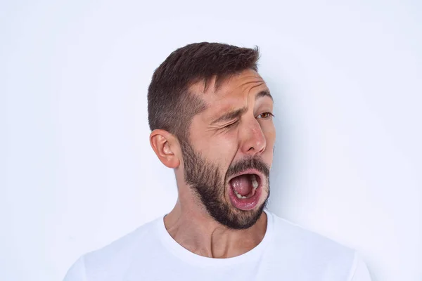 Young man suffering from Tourette syndrome or TS. Face nerve disorders — Stock Photo, Image