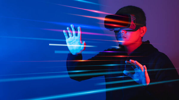 Young man wearing VR goggles. Metaverse technology virtual reality concept. Virtual Reality Device, Simulation, 3D, AR, VR, Innovation and Technology of the Future on Social Media.
