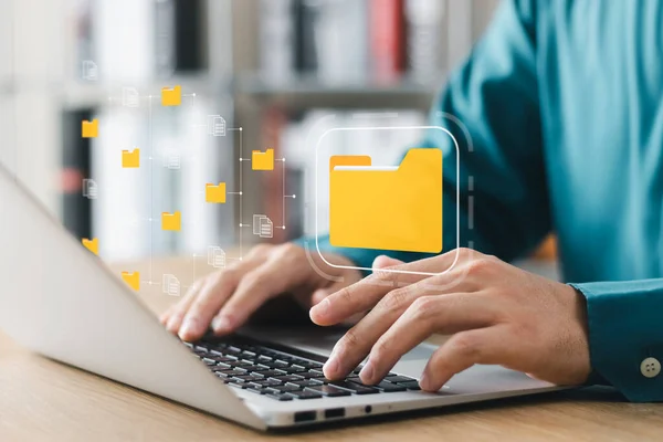 Document management system concept, business man holding folder and document icon software, searching and managing files online document database, for efficient archiving and company data.