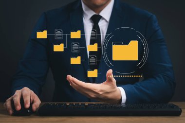 Document management system concept, business man holding folder and document icon software, searching and managing files online document database, for efficient archiving and company data.