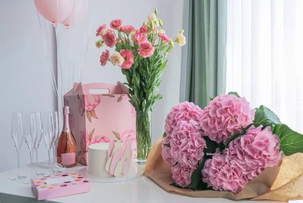 bouquet of pink flowers in a vase on the party