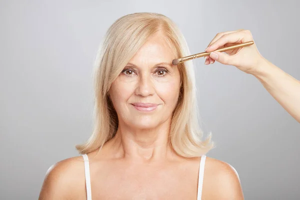 Happy Senior Blond Woman Getting Her Make Done Beautician Putting — Stock Photo, Image